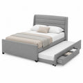 Cama de tela gris con almacenamiento y cama nido